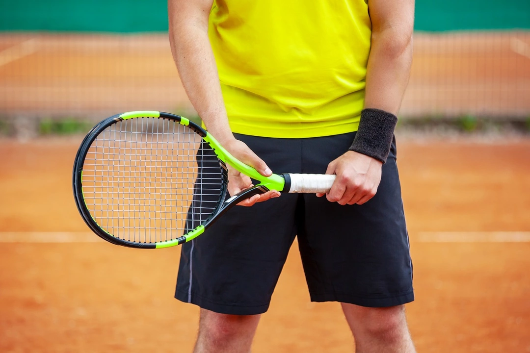 Why do tennis players change so many rackets in a match?