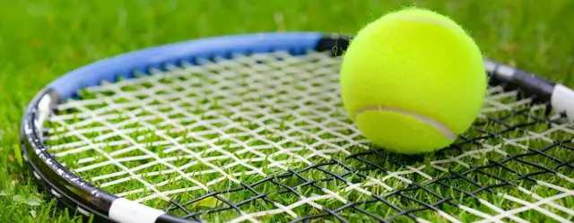 How do you put spin on a tennis ball?